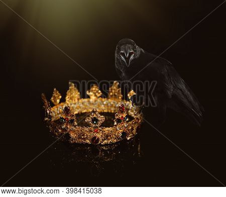 Fantasy World. Black Crow Lit By Magic Light Sitting On Golden Crown