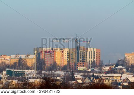 New Modern Multi-storey Houses Against The Backdrop Of Small Village Houses On A Natural Rural Lands