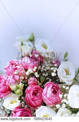 Festive Flower Arrangement - White And Pink Eustoms On A White Background. Background For A Holiday 