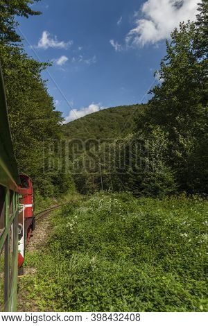 Narrow Gauge Railway View From Train For Forests And Meadows In Poland Mountains