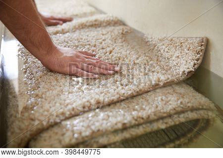 Dirty Carpet Soaking In Special Chemical Solution In Carpet Cleaning Service