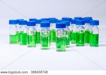 Hplc Vials With Green Sample Of Plant Extracts. Developing Of Drugs Based On Natural Products. Bioch