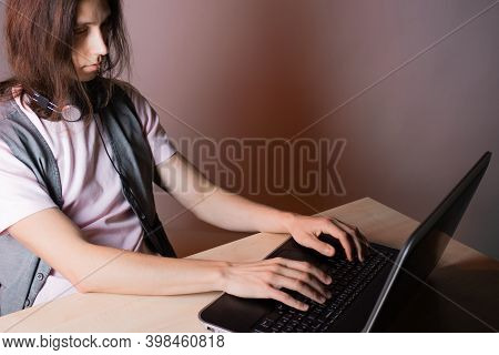 Write Code And Learn Programming Languages. A Student Or Specialist Is Doing A Project. The Guy Is A