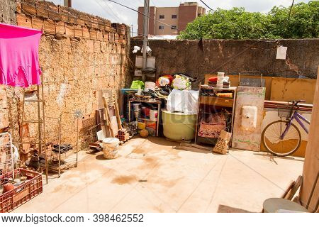 Planaltina, Goias, Brazil, December 5, 2020: Junk Piled Up In Front Of A House That A Family Resales