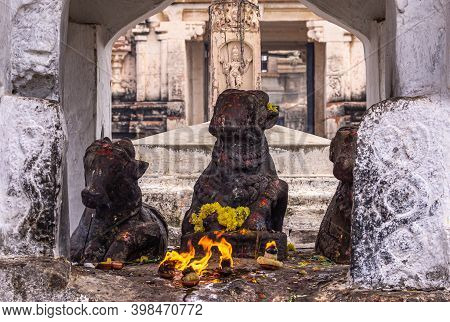 Hampi, Karnataka, India - November 4, 2013: Virupaksha Temple Complex. Closeup Of 3 Nandi Black Stat
