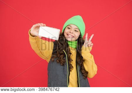 Merry Christmas Greeting. New Year Congratulations. Happy Teen Girl Making Selfie With Smartphone. X