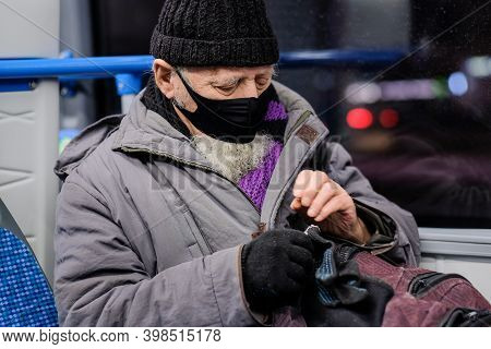 Moscow. Russia. December 8, 2020. An Old Man In A City Bus Wearing A Protective Medical Mask. Preven