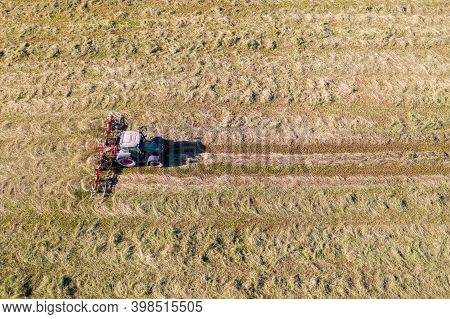 Top View Of Tractor With Tedders, Drying Mowed Hay