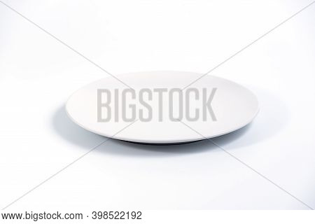 Empty White Plate Isolated On White Background Side View, Selective Focus