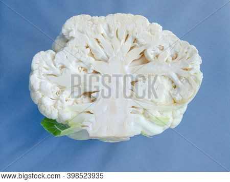 Falling Cauliflower Isolated On Blue Background, Clipping Path, Full Depth Of Field