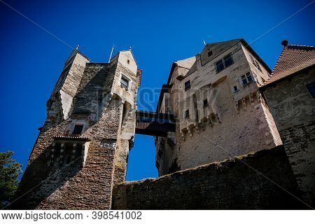 Gothic Imposing Historic Castle Pernstejn At Sunny Summer Day, Stronghold On Rock Above Village Of N