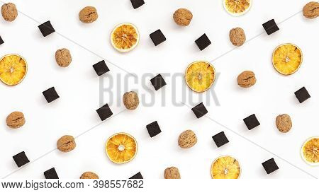 Coals For Hookah With Dry Oranges And Walnuts On White Background - Top View