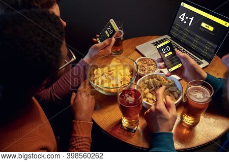 Support. Excited Fans In Bar With Beer And Mobile App For Betting, Score On Their Devices. Screen Wi
