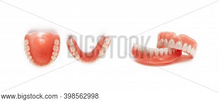 Full Removable Plastic Denture Of The Jaws. Set Of Dentures On A White Background. Two Acrylic Dentu