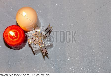 Congratulations On The Holiday. Postcard With Candles And A Rose On A Pink And White Background