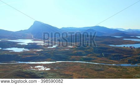 Mount Bitihorn In Jotunheimen National Park In Norway. In Sharp Contrast To A Bright Sun.
