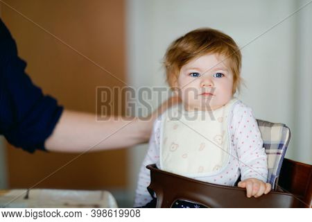 Father Feeding Baby Girl From Spoon Mashed Vegetables And Puree. Food, Child, Feeding And People Con