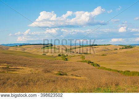 Bagno Vignoni, Italy - September 3rd 2020. The late summer landscape around Bagno Vignoni in in Val d\'Orcia, Siena Province, Tuscany, Italy