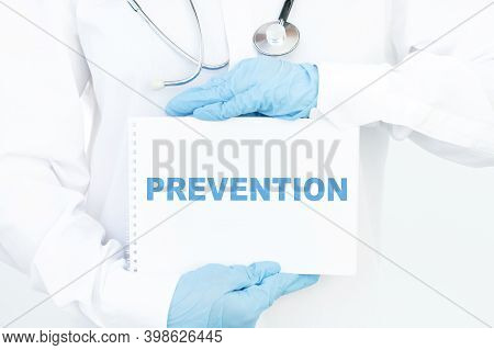 Doctor Holding A Card With Text Prevention,medical Concept