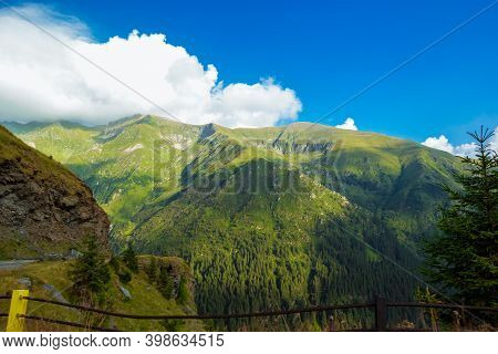 Romanian Carpathian Mountains On A Summertime. Amaizing View On The Mountains And Cloudy Sky From Tr