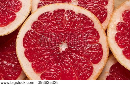 Slices Of Grapefruit Close-up. Abstract Background, Fruit Texture. Bright Summer Texture.