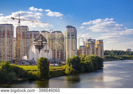 Modern Cityscape With Orthodox Church Under Construction