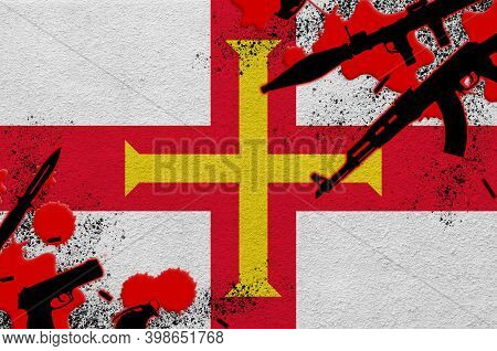 Guernsey Flag And Various Weapons In Red Blood. Concept For Terror Attack And Military Operations Wi