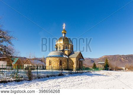 Beautiful Winter Landscape With Mountains And Orthodox Church