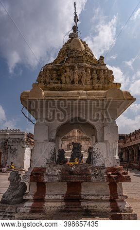 Hampi, Karnataka, India - November 4, 2013: Virupaksha Temple Complex. 3 Nandi Statue In Their Own S