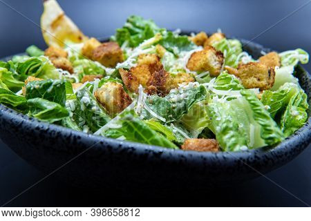 Delicious Caesar Salad Topped With Parmesean Cheese And Dressing Makes The Mouth Water And The Stoma