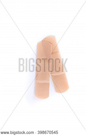 Two Pieces Of Colored Bandage Strips Top Down View