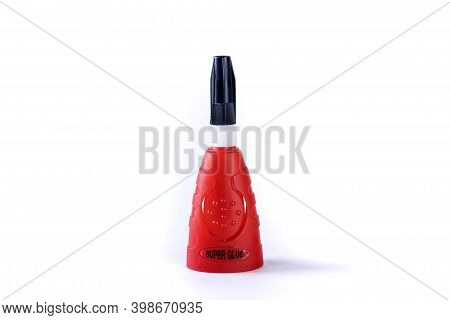 Head On View Of A Bottle Of Quick Drying One Contact Super Glue With Label