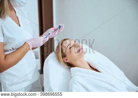 Doctor Preparing For Administering The Platelet-rich Plasma Injection