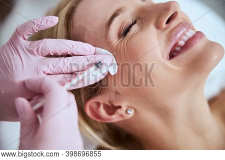 Woman Client Getting Rid Of Crows Feet