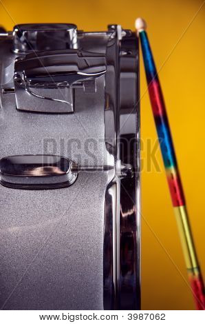 Silver Sparkel Snare Drum And Sicks Isolated On Gold
