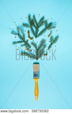Creative Composition Christmas And New Year. Paint Brush With Christmas Fir And Ornaments On A Red B