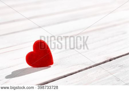 Red Felted Heart On White Wooden Background. Valentines Day. Romance Greeting Card. Copy Space. Mini