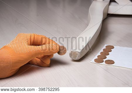Hand Stick Floor Care Pad At Chair Wooden Legs. Anti-skid Felt Pad Cover Sticking On Wooden Furnitur