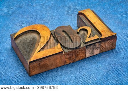 2021 year in vintage, gritty letterpress wood type against handmade bark paper, New Year concept