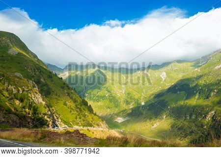 Romanian Carpathian Mountains On A Summer Sunny Day. Amaizing View On The Mountains And Cloudy Sky F