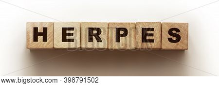 Herpes Word Made With Wooden Blocks On White. Healthcare Concept