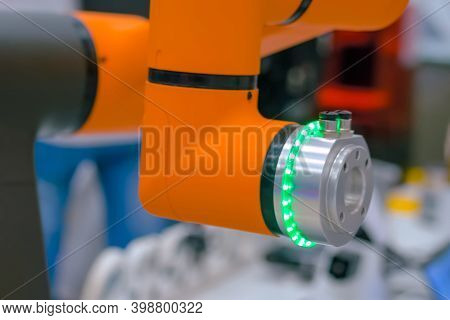 Orange Collaborative Robot, Cobot Hand Moving At Robotic Exhibition, Trade Show - Close Up View. Sci