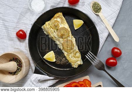 Fried Baked Mackerel Trachurus With Onions And Dried Herbs In An Old Frying Pan In A Towel With A Fo
