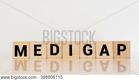 Word Medigap Made With Wood Building Blocks.