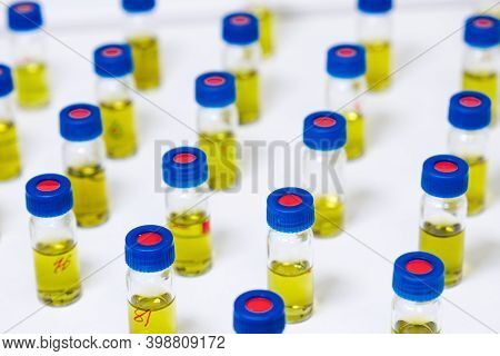 Pattern From Hplc Glass Vials With Yellow Fluid. Pharmaceuticals And Chemical Analysis.
