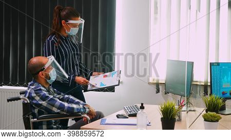 Business People Wearing Protective Mask In New Normal Office Discussing Strategy, Businessman Sittin