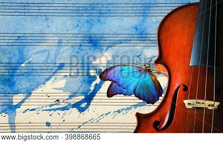 Violin On The Background Of The Sheet Music. Violin On Blue Watercolor Background Closeup. Beautiful