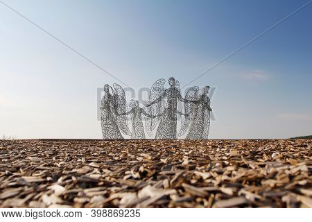 Kamenka, Lipetsk Oblast, Russia - August 07, 2020: Metal Sculpture Of Angels Holding Hands As Art Ob