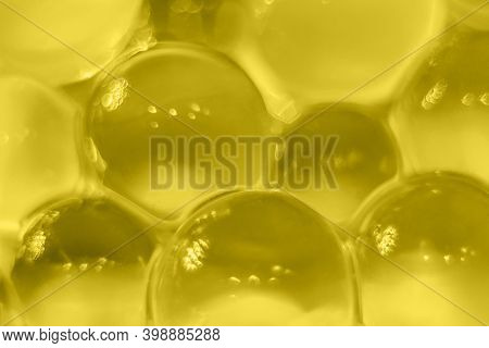 Abstract Yellow Texture, Crystalline Balls Of Hydrogel For The Background. Hydrogel Beads. Close Up 