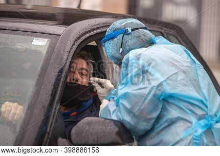 A Medical Worker Wearing Special Suit To Protect Against Coronavirus, Conduct A 